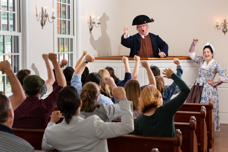 Boston: Boston Tea Party Ships and Museum Interactive Tour - Throwing tea from a recreated ship