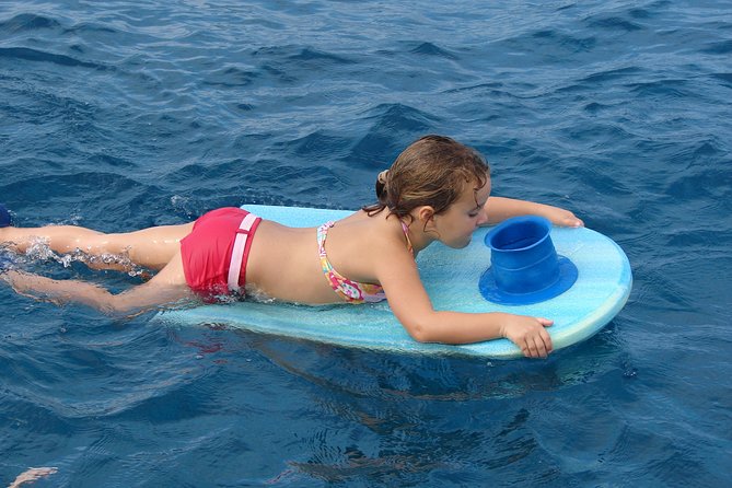 Deluxe Snorkel & Dolphin Watch Aboard a Luxury Catamaran from Kailua-Kona - The slide, high jump, and floating toys