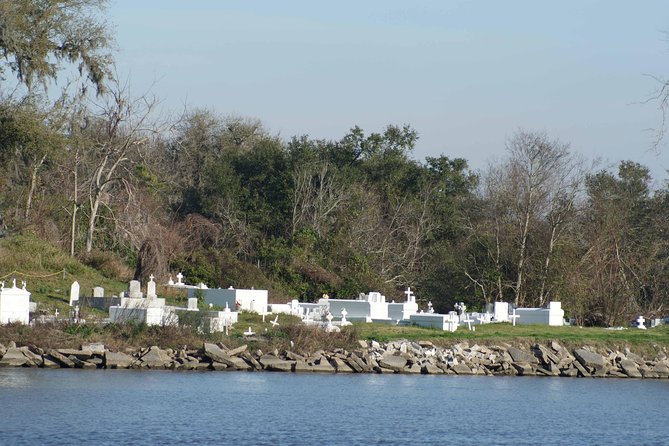 New Orleans Swamp Tour Boat Adventure - The Cajun cemetery, burial mound, and fishing village