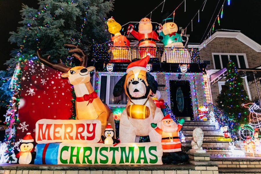 NYC: Dyker Heights Christmas Lights & Skyline View Bus Tour - Walking through Dyker Heights after dark
