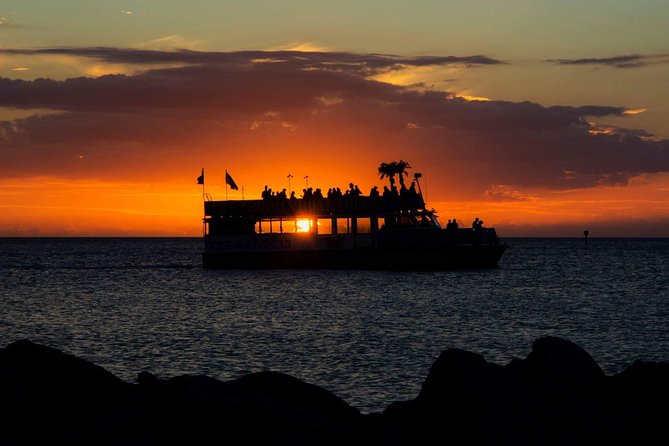 Sunset Celebration Cruise on Tropics Boat Tours - The ride out: local facts, music, and dolphin watch